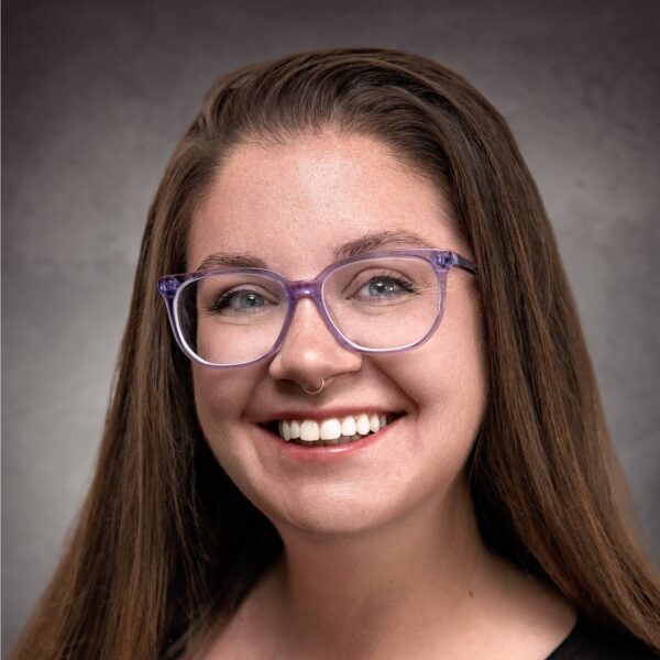 Tess Ulrey Headshot (Gray)